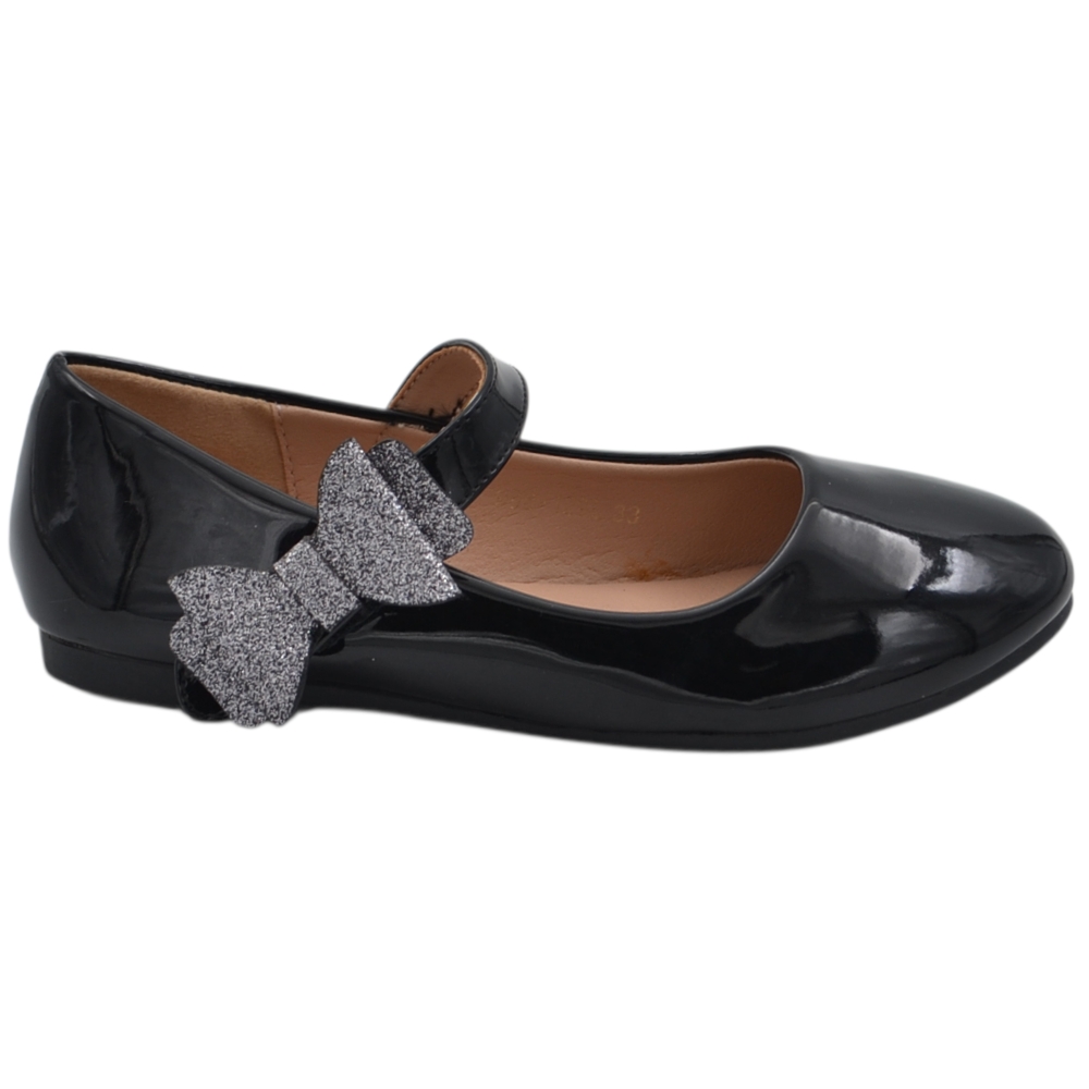 Ballerine da bambina nere in vernice brillante Mary Jane con fiocco glitterato e cinturino a strappo.