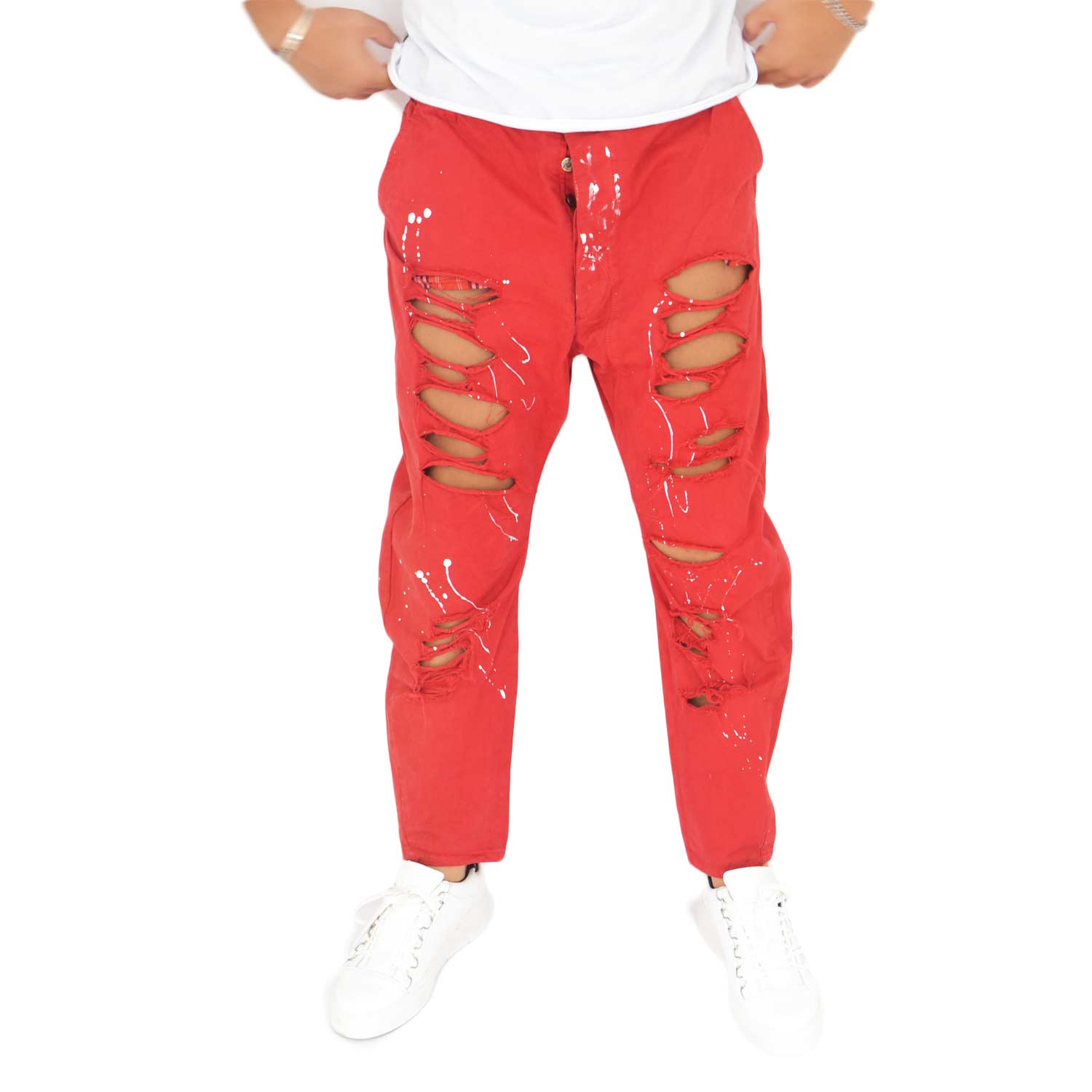 Jeans skinny color rosso , schizzi di colore bianco e strappi  chiusura con cerniera glamour